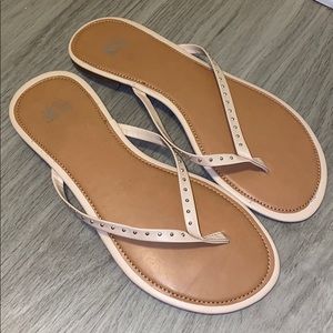 Nude studded flip flops